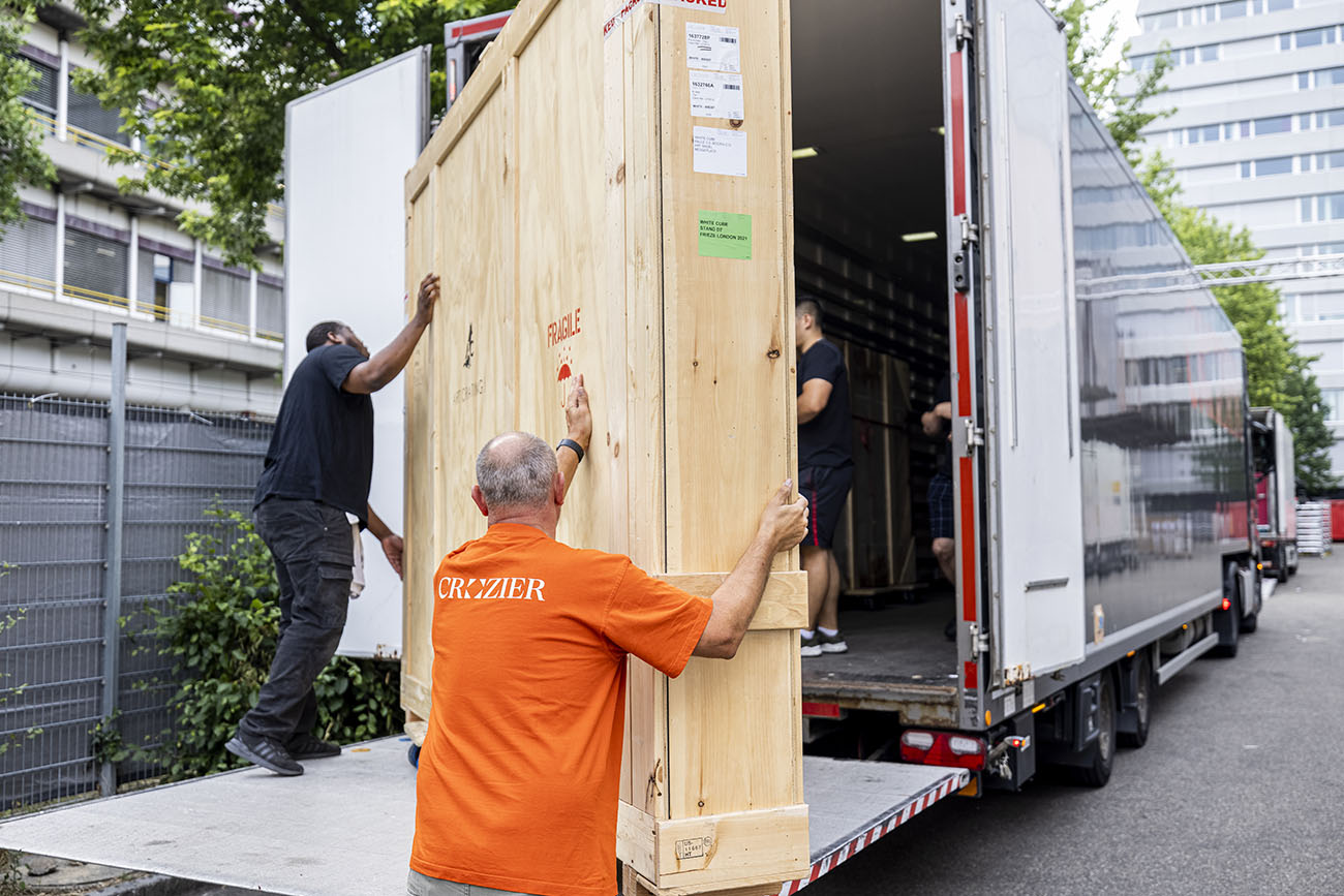 Crozier's expert art handlers carefully move a large transit crate 