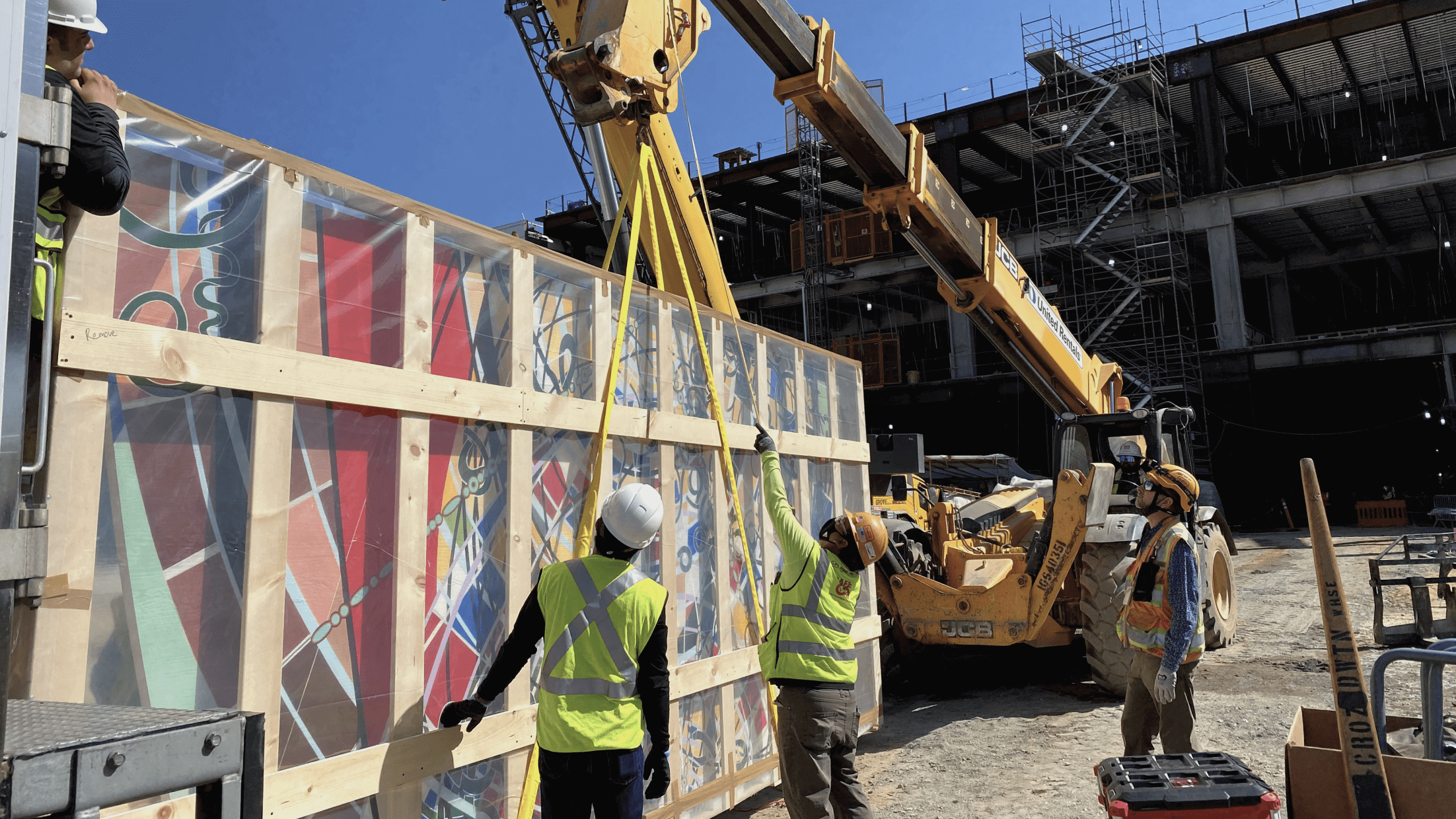 There were stringent procedures in place to deliver the heavy panels to the job site, including trucking the art in across the tarmac and lifting it in through the third floor in order to access the terminal. 