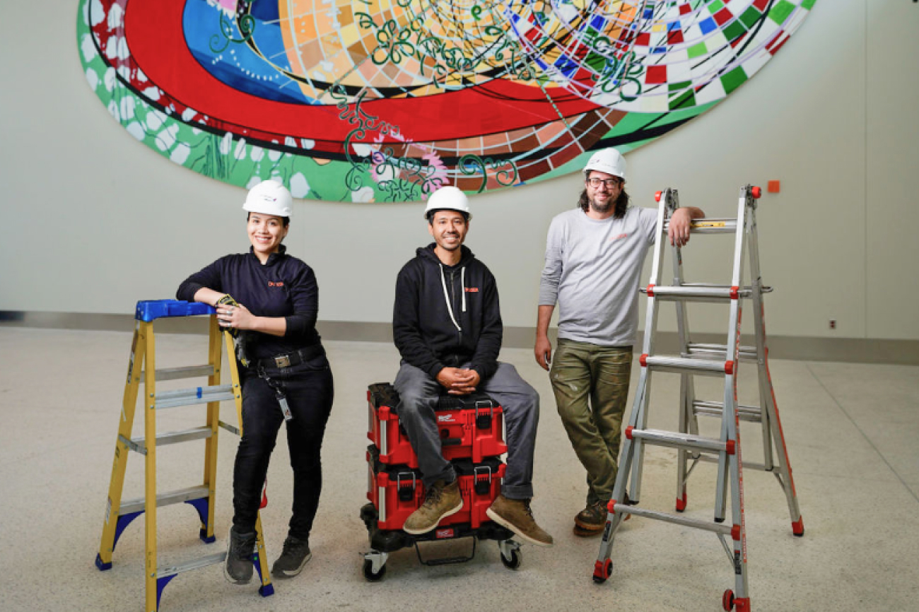 Crozier team members at the LAX Delta Terminal installation of 'Just What Is Your Position' by Renée Petropoulos