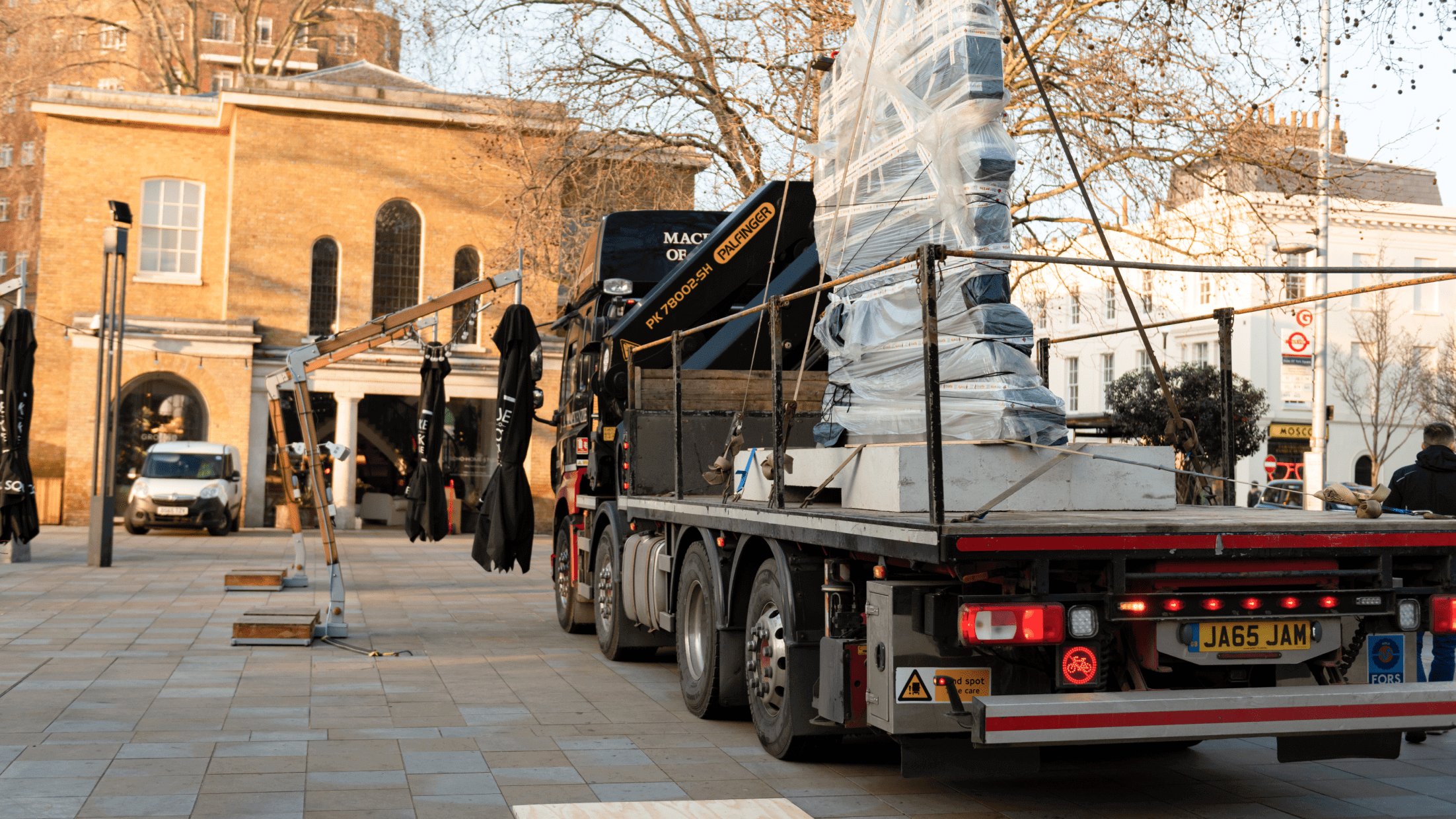 Crozier's art transport team moving VHILS's sculpture into Duke of York Square to finalize the exhibition.