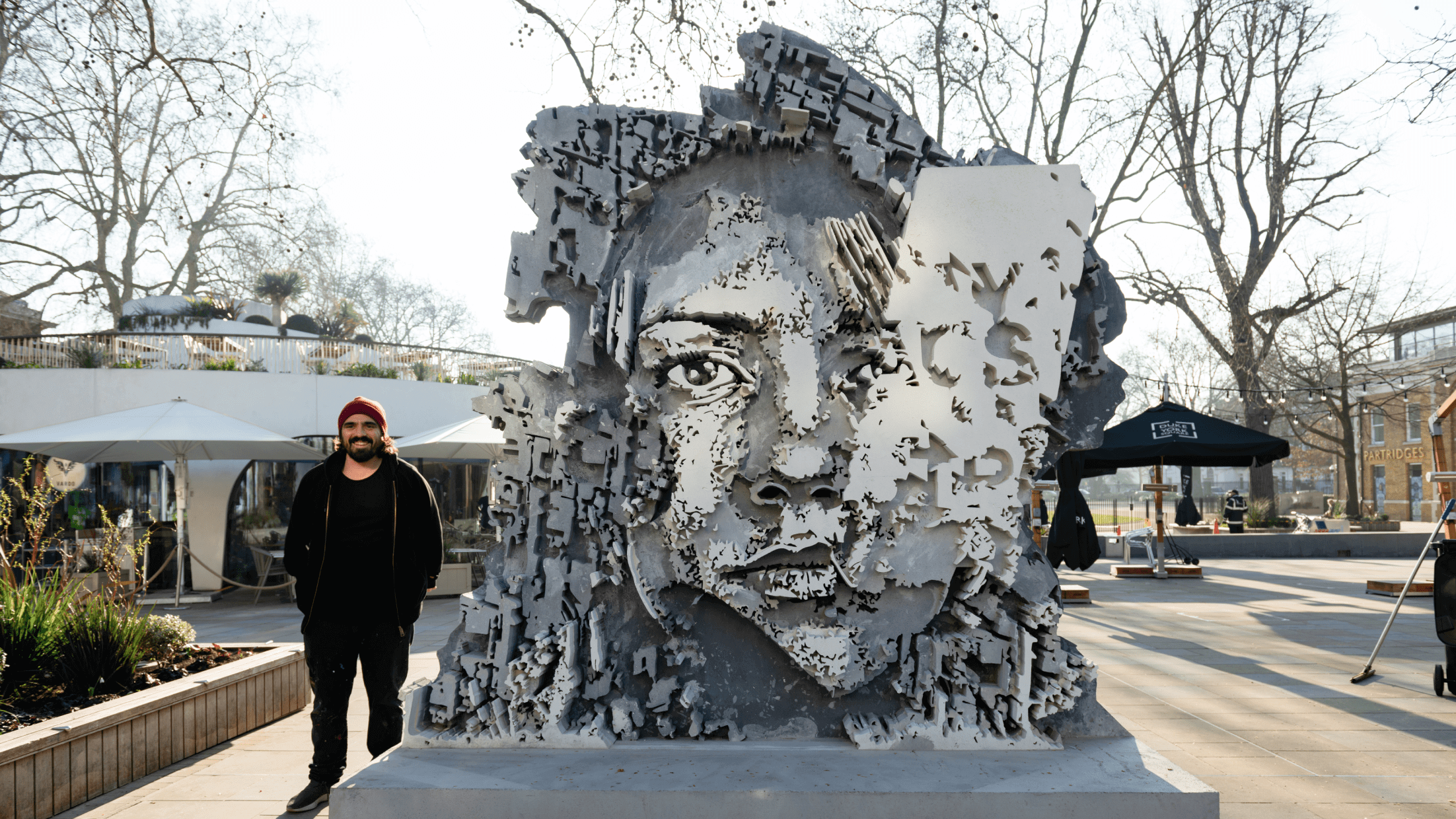 The artist, VHILS, stands by his installed work.