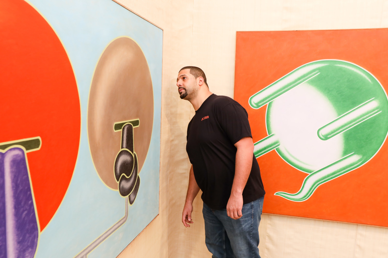 A Crozier technician inspecting a painting