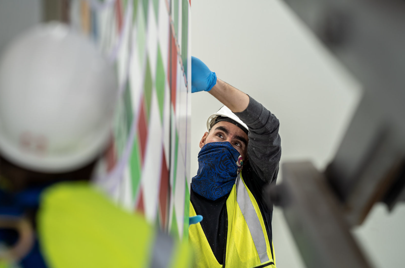 Crozier's expert art handlers carefully move a piece of work