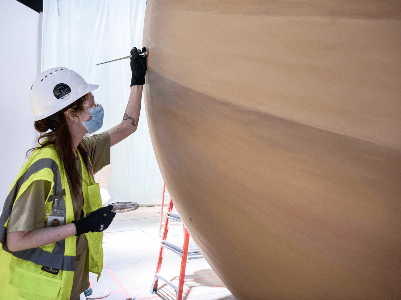 An artist touches up Saturn, which we eventually installed in interactive Kenneth C. Griffin 'Exploring the Planets' gallery. Photo courtesy of Jim Preston / The Washingtonian