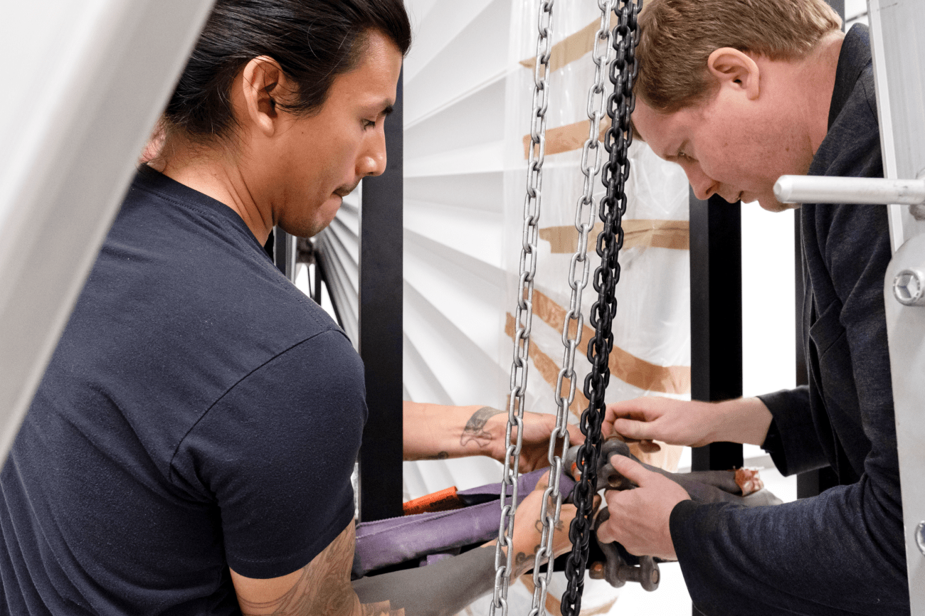 Crozier technicians secure and prepare the installation of a sculpture by Anish Kapoor 